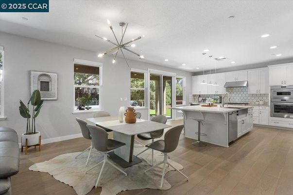 Dining room, Interior, Kitchen, Pendant Lights, Recessed Lighting, Stainless Steel Appliances, Wood Texture Flooring