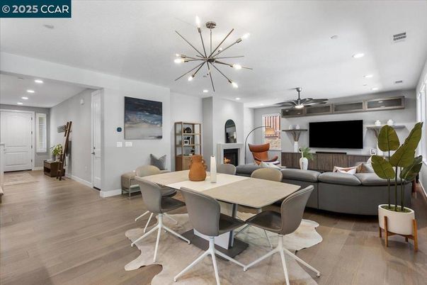 Dining room, Fireplace, Interior, Living room, Pendant Lights, Recessed Lighting, Wood Texture Flooring