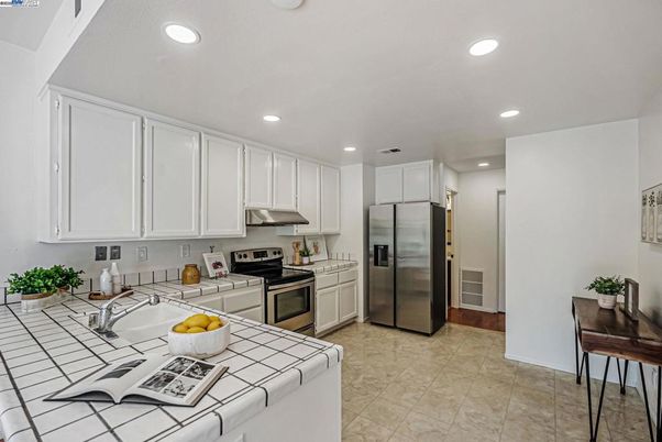 Interior, Kitchen, Recessed Lighting, Stainless Steel Appliances, Tile Countertops