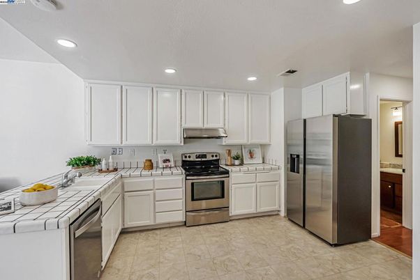 Interior, Kitchen, Recessed Lighting, Stainless Steel Appliances, Tile Countertops