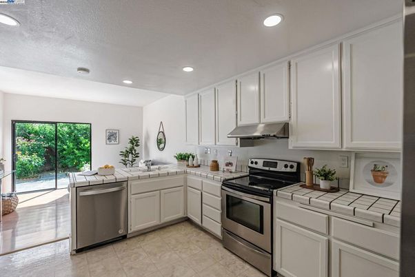 Interior, Kitchen, Recessed Lighting, Stainless Steel Appliances, Tile Countertops