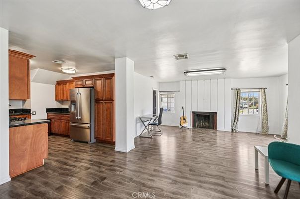 Fireplace, Interior, Kitchen, Stainless Steel Appliances, Wood Texture Flooring