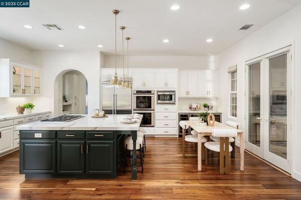 Dining room, Interior, Kitchen, Pendant Lights, Recessed Lighting, Stainless Steel Appliances, Wood Texture Flooring