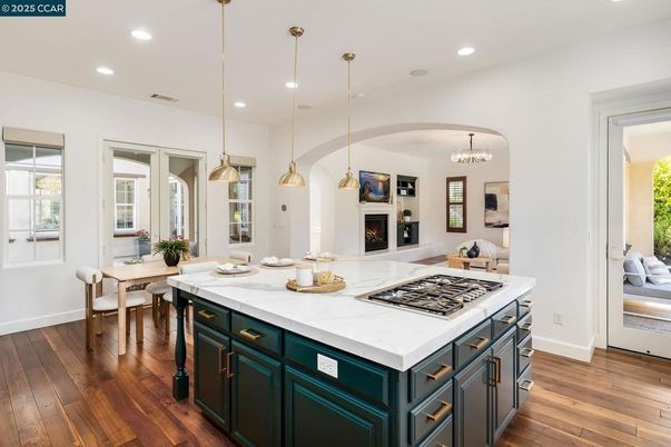 Chandelier, Dining room, Fireplace, Interior, Kitchen, Pendant Lights, Recessed Lighting, Wood Texture Flooring
