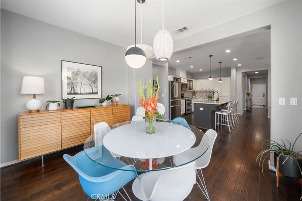 Dining room, Interior, Kitchen, Pendant Lights, Recessed Lighting, Stainless Steel Appliances, Wood Texture Flooring