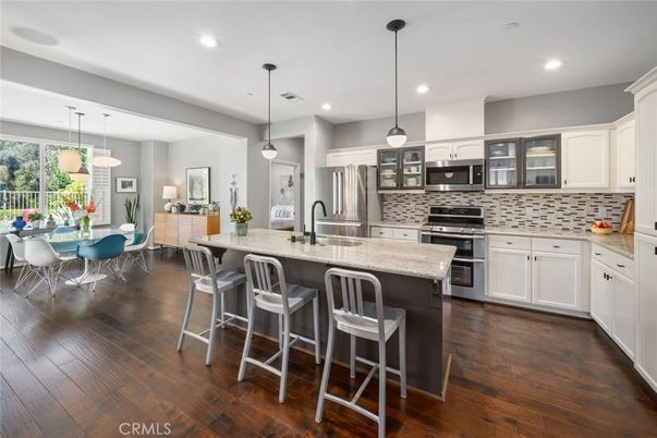 Dining room, Interior, Kitchen, Pendant Lights, Recessed Lighting, Stainless Steel Appliances, Wood Texture Flooring