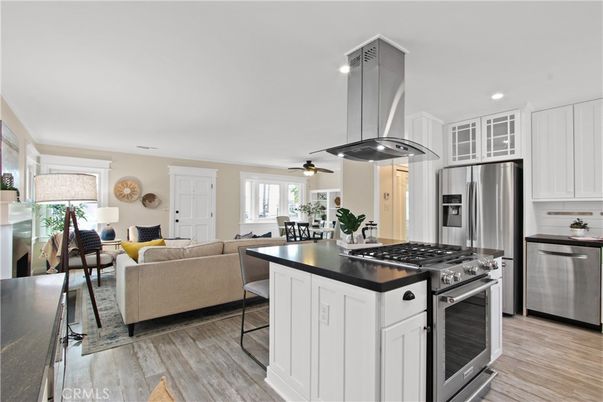 Dining room, Interior, Kitchen, Living room, Recessed Lighting, Stainless Steel Appliances, Wood Texture Flooring