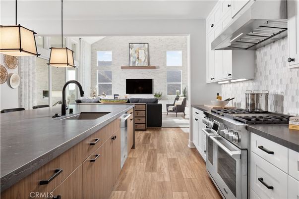 Fireplace, Interior, Kitchen, Living room, Pendant Lights, Stainless Steel Appliances, Stone Walls, Wood Texture Flooring