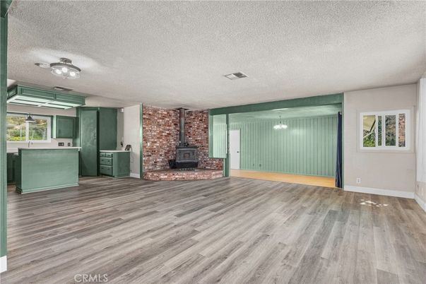Empty room, Fireplace, Interior, Pendant Lights, Stone Walls, Wood Texture Flooring