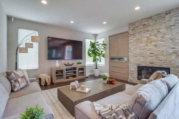 Fireplace, Interior, Living room, Recessed Lighting, Stone Walls, Wood Texture Flooring