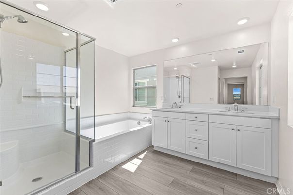 Bathroom, Dual Sink Vanities, Glass Shower, Interior, Recessed Lighting, Wood Texture Flooring