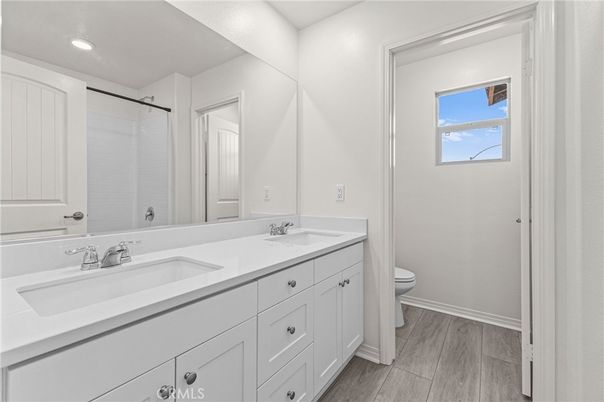 Bathroom, Dual Sink Vanities, Interior, Recessed Lighting, Wood Texture Flooring