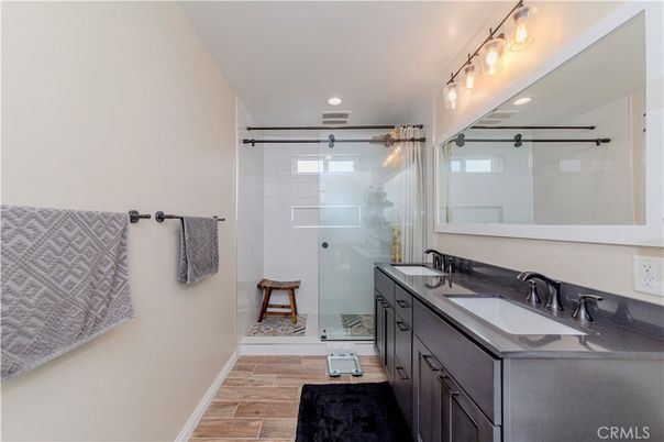 Bathroom, Dual Sink Vanities, Glass Shower, Interior, Recessed Lighting, Wood Texture Flooring