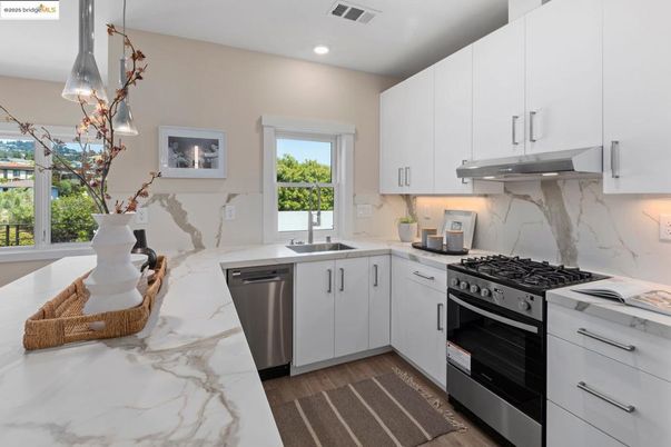 Interior, Kitchen, Marble Walls, Recessed Lighting, Stainless Steel Appliances, Wood Texture Flooring