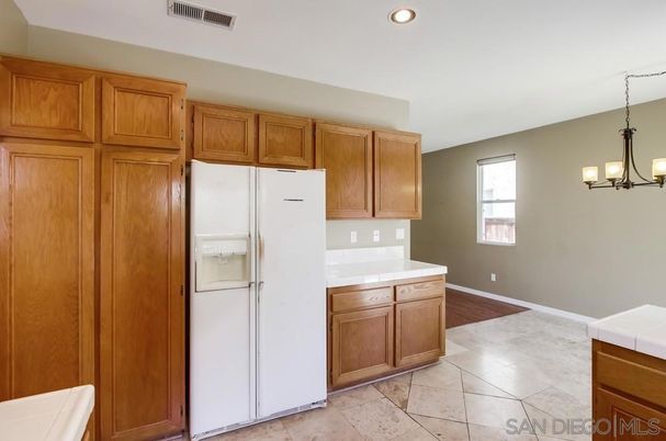 Chandelier, Interior, Kitchen, Recessed Lighting, Tile Countertops, Wood Texture Flooring