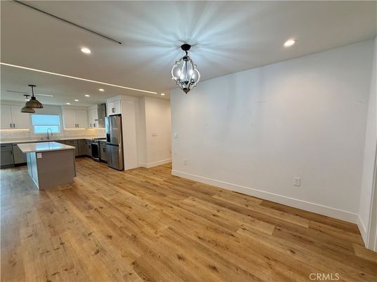 Chandelier, Interior, Kitchen, Pendant Lights, Recessed Lighting, Stainless Steel Appliances, Wood Texture Flooring