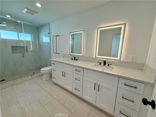 Bathroom, Dual Sink Vanities, Glass Shower, Interior, Marble Walls, Recessed Lighting