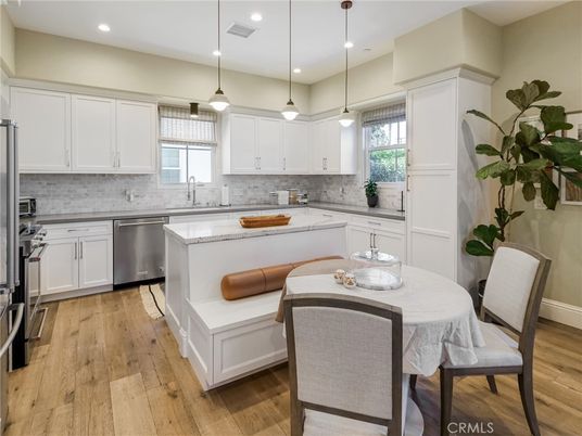 Dining room, Interior, Kitchen, Pendant Lights, Recessed Lighting, Stainless Steel Appliances, Wood Texture Flooring