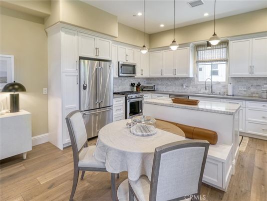 Dining room, Interior, Kitchen, Pendant Lights, Recessed Lighting, Stainless Steel Appliances, Wood Texture Flooring