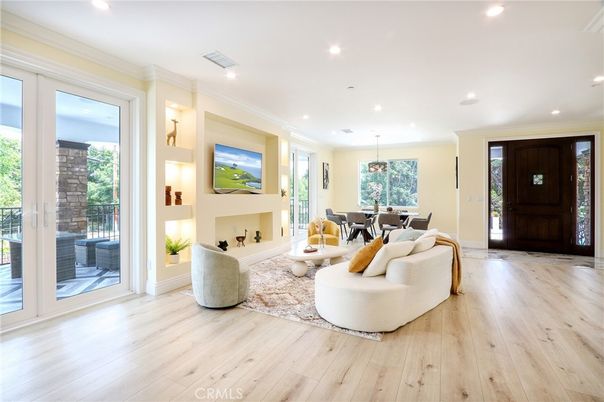 Dining room, Fireplace, Interior, Living room, Pendant Lights, Recessed Lighting, Wood Texture Flooring