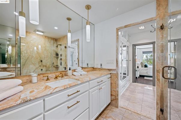 Bathroom, Bedroom, Dual Sink Vanities, Glass Shower, Interior, Marble Walls, Pendant Lights, Recessed Lighting