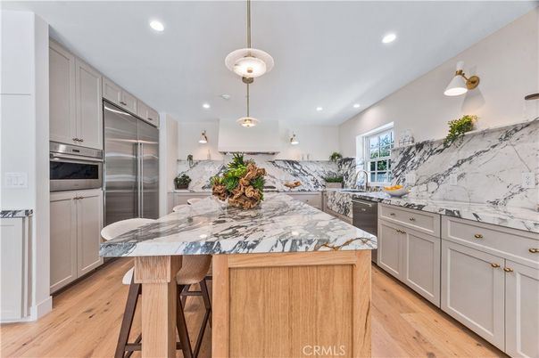 Interior, Kitchen, Marble Walls, Pendant Lights, Recessed Lighting, Stainless Steel Appliances, Wood Texture Flooring