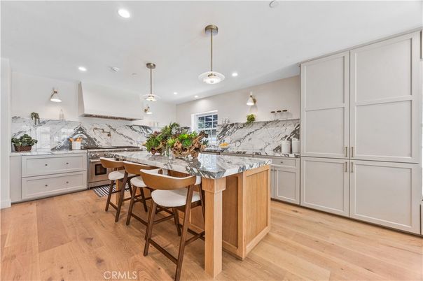 Interior, Kitchen, Marble Walls, Pendant Lights, Recessed Lighting, Stainless Steel Appliances, Wood Texture Flooring