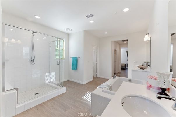 Bathroom, Dual Sink Vanities, Glass Shower, Interior, Recessed Lighting, Wood Texture Flooring