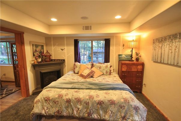 Bedroom, Fireplace, Interior, Recessed Lighting, Wood Texture Flooring