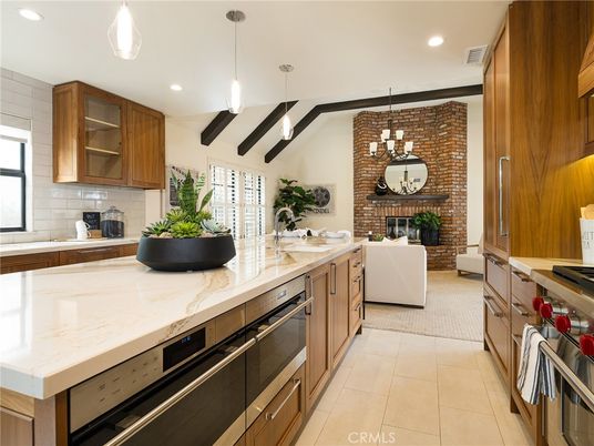 Fireplace, Interior, Kitchen, Living room, Pendant Lights, Recessed Lighting, Stainless Steel Appliances, Stone Walls