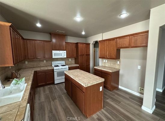 Interior, Kitchen, Recessed Lighting, Tile Countertops, Wood Texture Flooring