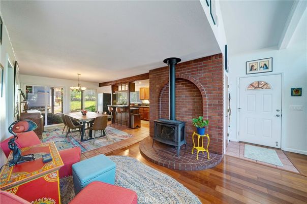 Chandelier, Dining room, Fireplace, Interior, Kitchen, Pendant Lights, Stone Walls, Wood Texture Flooring
