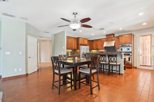 Dining room, Interior, Kitchen, Recessed Lighting, Stainless Steel Appliances, Wood Texture Flooring