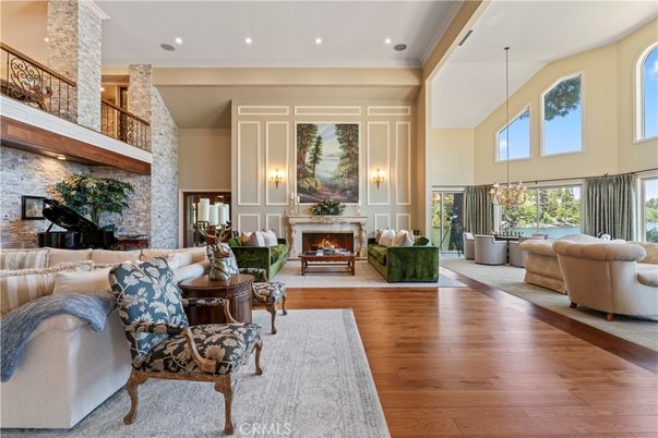 Fireplace, Interior, Living room, Pendant Lights, Piano, Recessed Lighting, Stone Walls, Wood Texture Flooring