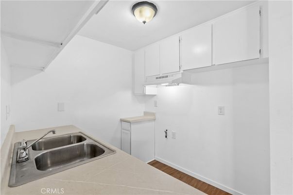 Interior, Kitchen, Tile Countertops, Wood Texture Flooring