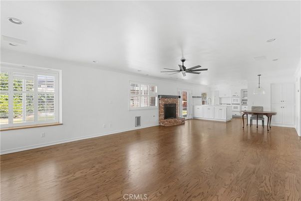 Dining room, Empty room, Fireplace, Interior, Pendant Lights, Recessed Lighting, Wood Texture Flooring