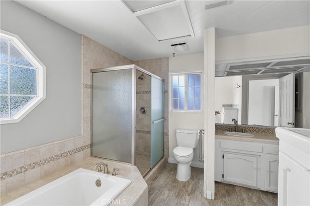 Bathroom, Dual Sink Vanities, Glass Shower, Interior, Wood Texture Flooring