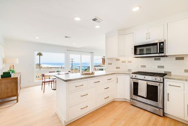 Dining room, Interior, Kitchen, Recessed Lighting, Stainless Steel Appliances, Water, Wood Texture Flooring