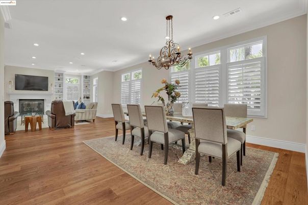 Chandelier, Dining room, Fireplace, Interior, Living room, Recessed Lighting, Wood Texture Flooring