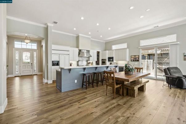 Dining room, Interior, Kitchen, Pendant Lights, Recessed Lighting, Stainless Steel Appliances, Wood Texture Flooring
