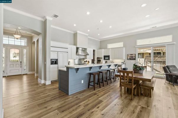 Dining room, Interior, Kitchen, Pendant Lights, Recessed Lighting, Stainless Steel Appliances, Wood Texture Flooring