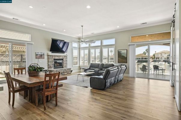 Dining room, Fireplace, Interior, Living room, Recessed Lighting, Wood Texture Flooring