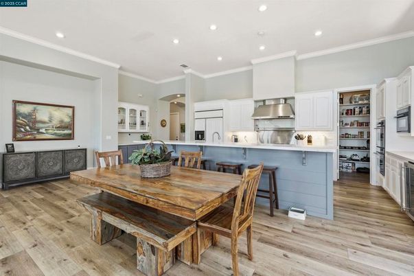 Dining room, Interior, Kitchen, Recessed Lighting, Stainless Steel Appliances, Wood Texture Flooring