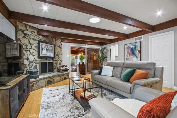 Fireplace, Interior, Living room, Recessed Lighting, Stone Walls, Wooden Beams, Wood Texture Flooring