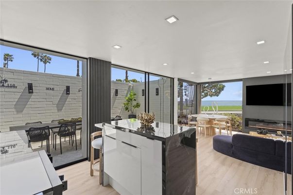 Dining room, Fireplace, Interior, Living room, Recessed Lighting, Water, Wood Texture Flooring