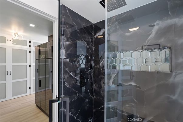 Bathroom, Glass Shower, Interior, Marble Walls, Recessed Lighting, Wood Texture Flooring