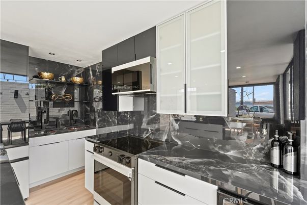Dining room, Interior, Kitchen, Marble Walls, Recessed Lighting, Stainless Steel Appliances, Wood Texture Flooring