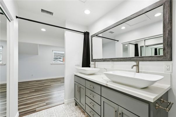 Bathroom, Dual Sink Vanities, Interior, Recessed Lighting, Wood Texture Flooring