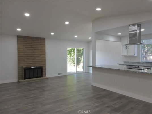 Empty room, Fireplace, Interior, Kitchen, Recessed Lighting, Wood Texture Flooring