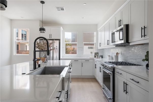Interior, Kitchen, Pendant Lights, Recessed Lighting, Stainless Steel Appliances, Wood Texture Flooring